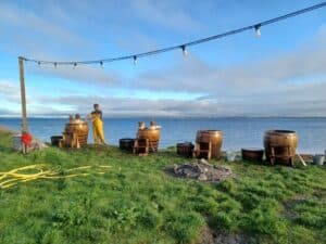 Picture of people sitting in a whiskey barrel